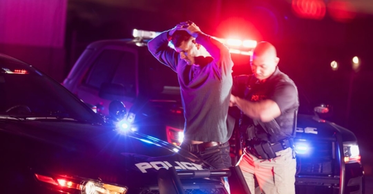 man being arrested by police